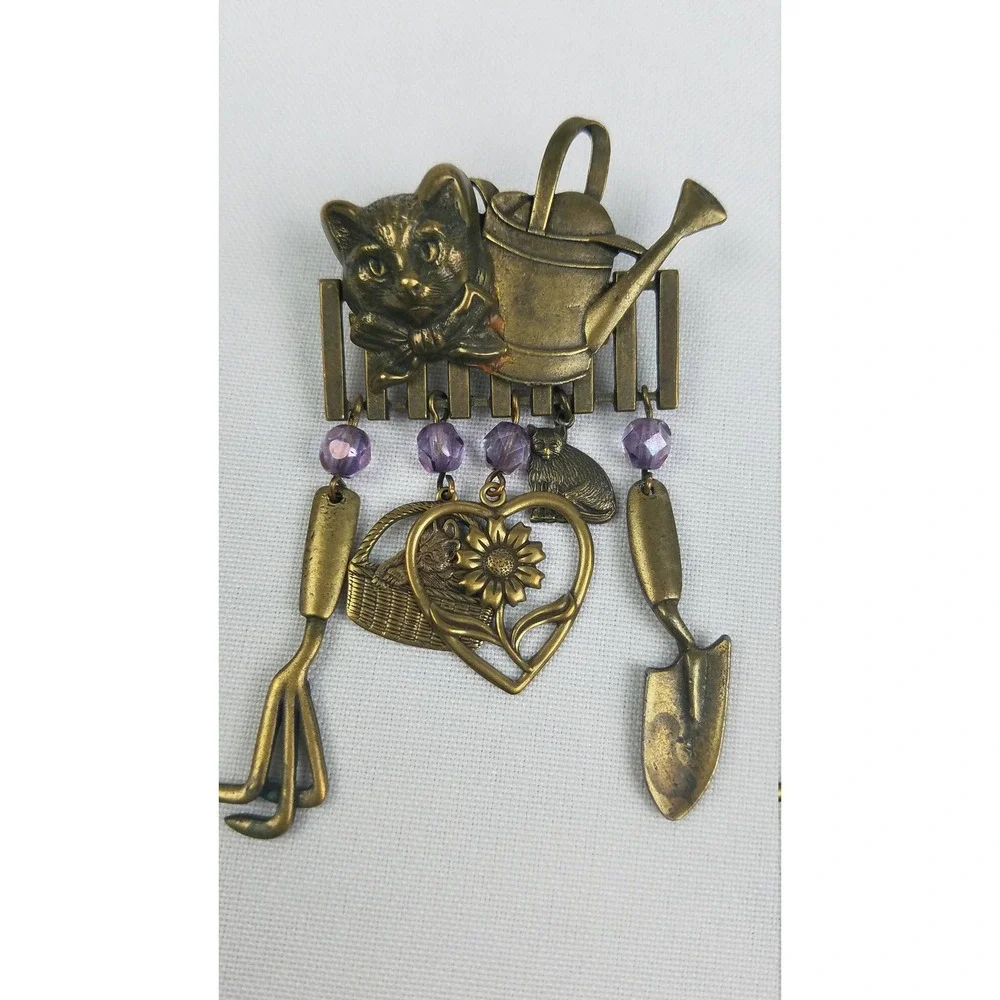 Vintage JJ brooch pin gold tone cat head on fence gardening tools